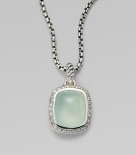From the Noblesse Collection. A beautiful center stone of aqua chalcedony surrounded by a row of brilliant diamonds on a sterling silver box link chain. Aqua chalcedonyDiamonds, .3 tcwSterling silverLength, about 17Pendant size, about ½Lobster clasp closureImported 