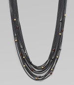 From the Blackened Chain Collection. This beautiful, multi-row design is embellished with faceted garnet, hematite and 18k gold station beads. Garnet, hematite and 18k gold beadsBlacked sterling silverLength, about 16½ to 18½ adjustableToggle closureImported 