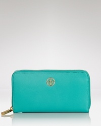 Loved for it's polished look, Tory Burch's zip around wallet is an ever-chic essential. With eight credit card pockets and an interior zip pocket, this latest piece from the NYC label offers the substance to match the style. Loved for it's polished look, Tory Burch's zip around wallet is an ever-chic essential. With eight credit card pockets and an interior zip pocket, this latest piece from the NYC label offers the substance to match the style.