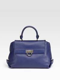 Richly textured calfskin with clean, refined lines and stunning silvertone accents at the front and sides.Top handle, 4 drop Removable shoulder strap, 18 drop Lock flap closure One outside zip pocket Protective metal feet One inside zip pocket Two inside open pockets Nylon lining 14W X 9H X 5D Made in Italy Richly textured calfskin with clean, refined lines and stunning silvertone accents at the front and sides.Top handle, 4 drop Removable shoulder strap, 18 drop Lock flap closure One outside zip pocket Protective metal feet One inside zip pocket Two inside open pockets Nylon lining 14W X 9H X 5D Made in Italy