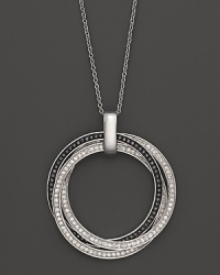 Faceted black and white diamonds set in gleaming 14K white gold. Faceted black and white diamonds set in gleaming 14K white gold.