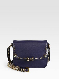 A supple leather design accented with studs, rhinestones and a sweet bow.Adjustable shoulder strap, 19-20 dropMagnetic snap flap closureThree inner compartmentsOne inside zip pocketOne inside open pocketSatin lining8½W X 6½H X 3¾DMade in Italy A supple leather design accented with studs, rhinestones and a sweet bow.Adjustable shoulder strap, 19-20 dropMagnetic snap flap closureThree inner compartmentsOne inside zip pocketOne inside open pocketSatin lining8½W X 6½H X 3¾DMade in Italy