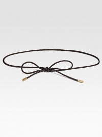 This slender, braided leather cord is tipped in elegant goldtone caps, and can be knotted in a variety of stylish ways.About ¼ in diameterGoldtone metal tipsLeatherImported of Swiss fabric This slender, braided leather cord is tipped in elegant goldtone caps, and can be knotted in a variety of stylish ways.About ¼ in diameterGoldtone metal tipsLeatherImported of Swiss fabric