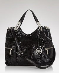 Practical and undeniable luxurious, this tote from MICHAEL Michael Kors is the ultimate daytime bag. Crafted from glossy patent leather with faux snakeskin accents, it's a wild way to carry on. Practical and undeniable luxurious, this tote from MICHAEL Michael Kors is the ultimate daytime bag. Crafted from glossy patent leather with faux snakeskin accents, it's a wild way to carry on.