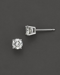 Traditional four prong round diamond stud earring in a white gold setting. Traditional four prong round diamond stud earring in a white gold setting.