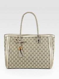 Timeless GG jacquard in a roomy carryall trimmed with metallic leather and a tassel accent.Braided double top handles, 7½ dropTop hook closureProtective metal feetCenter zip compartmentOne inside zip pocketTwo inside open pocketsLinen lining14¾W X 11H X 5½DMade in Italy Timeless GG jacquard in a roomy carryall trimmed with metallic leather and a tassel accent.Braided double top handles, 7½ dropTop hook closureProtective metal feetCenter zip compartmentOne inside zip pocketTwo inside open pocketsLinen lining14¾W X 11H X 5½DMade in Italy