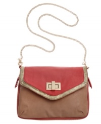 Polished details add shining appeal to this contemporary clutch from Danielle Nicole. The Tricia Clutch can be worn as either a crossbody or clutch, and features gleaming gold-tone hardware, metallic trim and a sleek chain strap. Polished details add shining appeal to this contemporary clutch from Danielle Nicole. The Tricia Clutch can be worn as either a crossbody or clutch, and features gleaming gold-tone hardware, metallic trim and a sleek chain strap.