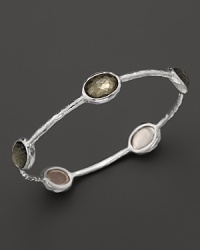 Faceted pyrite doublets dot a sterling silver bangle from Ippolita. Faceted pyrite doublets dot a sterling silver bangle from Ippolita.
