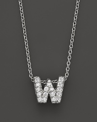 From the Tiny Treasures collection, a diamond W necklace. With signature ruby accent. Designed by Roberto Coin. From the Tiny Treasures collection, a diamond W necklace. With signature ruby accent. Designed by Roberto Coin.