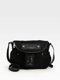 A slouchy flap design crafted of sturdy nylon with leather trim, finished with an over-sized luggage tag.Adjustable shoulder strap, 18-21 dropMagnetic flap closure with top zip compartmentOne outside open pocketOne inside zip pocketTwo inside open pocketsNylon lining11½W X 11H X 3¼DImported A slouchy flap design crafted of sturdy nylon with leather trim, finished with an over-sized luggage tag.Adjustable shoulder strap, 18-21 dropMagnetic flap closure with top zip compartmentOne outside open pocketOne inside zip pocketTwo inside open pocketsNylon lining11½W X 11H X 3¼DImported