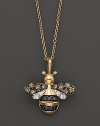 Black and brown diamonds, set in a 14K yellow gold bumblebee pendant, add sweetness to your look.