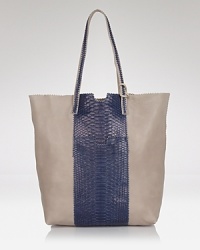 Exotic texture meets day-right style. This leather and python satchel from Carlos Falchi keeps it practical with a roomy interior but manages to stay extra luxe. Exotic texture meets day-right style. This leather and python satchel from Carlos Falchi keeps it practical with a roomy interior but manages to stay extra luxe.