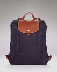 A timeless and durable nod to French style, Longchamp' nylon backpack stows any essentials for the très chic girl on the go. A timeless and durable nod to French style, Longchamp' nylon backpack stows any essentials for the très chic girl on the go.