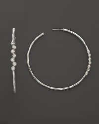 Faceted diamonds add gorgeous sparkle to slim sterling silver hoops. From the Silver Rain collection by Ippolita. Faceted diamonds add gorgeous sparkle to slim sterling silver hoops. From the Silver Rain collection by Ippolita.