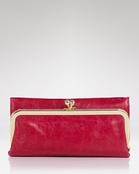 Deluxe double duty: Hobo's trifold wallet stashes your cash with chic ease and works overtime as a colorful clutch when the sun goes down. Deluxe double duty: Hobo's trifold wallet stashes your cash with chic ease and works overtime as a colorful clutch when the sun goes down.
