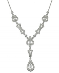 A vintage-inspired necklace that exudes charm, by Eliot Danori. The Splendor Y necklace boasts shimmering crystals and cubic zirconias (1/4 ct. t.w.). Crafted in rhodium-plated mixed metal. Approximate length: 16 inches + 2-inch extender. Approximate drop: 1-1/4 inches. A vintage-inspired necklace that exudes charm, by Eliot Danori. The Splendor Y necklace boasts shimmering crystals and cubic zirconias (1/4 ct. t.w.). Crafted in rhodium-plated mixed metal. Approximate length: 16 inches + 2-inch extender. Approximate drop: 1-1/4 inches.