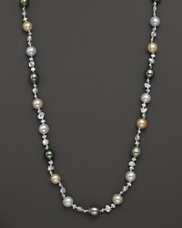 Dark Tahitian pearls, creamy South Sea pearls and freshwater pearls mingle and meet at a 14K white gold clasp. Dark Tahitian pearls, creamy South Sea pearls and freshwater pearls mingle and meet at a 14K white gold clasp.