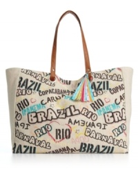 Set summer on fire with this ultra cool tote inspired by Brasil. A colorful graphic print front and multi-hue tassel charm give this design the perfect beach-ready appeal. Set summer on fire with this ultra cool tote inspired by Brasil. A colorful graphic print front and multi-hue tassel charm give this design the perfect beach-ready appeal.