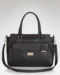 Cole Haan takes its utilitarian style a step beyond with this tote, crafted of leather and designed to be just as stylish as it is city savvy. Cole Haan takes its utilitarian style a step beyond with this tote, crafted of leather and designed to be just as stylish as it is city savvy.