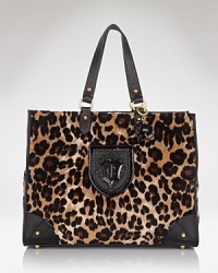 Juicy Couture has a whole new way to show your spots. Crafted of printed velour, this spaciously sized tote is a wildly practical daytime choice. Juicy Couture has a whole new way to show your spots. Crafted of printed velour, this spaciously sized tote is a wildly practical daytime choice.