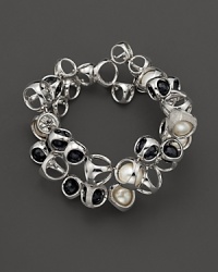 A bold sterling silver bracelet, gleaming with diamonds, black onyx and freshwater pearls, is an elegant showcase for Di MODOLO's iconic Triadra design. A bold sterling silver bracelet, gleaming with diamonds, black onyx and freshwater pearls, is an elegant showcase for Di MODOLO's iconic Triadra design.