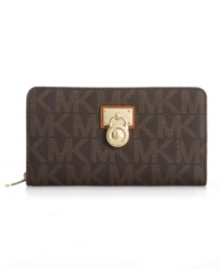 With a luxe 18K gold plaque and signature lock, it's easy to see why this discrete design from MICHAEL Michael Kors is the ultimate accessory. Eye-catching logo pattern graces the exterior, while plenty of internal compartments for cards, cash and ID keep your essentials organized. With a luxe 18K gold plaque and signature lock, it's easy to see why this discrete design from MICHAEL Michael Kors is the ultimate accessory. Eye-catching logo pattern graces the exterior, while plenty of internal compartments for cards, cash and ID keep your essentials organized.