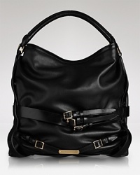 Chic straps help this leather Burberry tote ease from day to evening in sleek style. Chic straps help this leather Burberry tote ease from day to evening in sleek style.