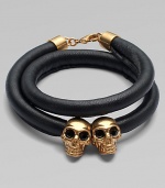 Two iconic, crystal accented skull beads on a luxurious, wrapped leather cord. Leather cordSilvertone brassCrystalsLength, about 14Lobster clasp closureMade in Italy