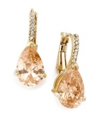 Add an extra hint of elegance to your evening wear. These classy drop earrings by City by City feature a pear-cut champagne cubic zirconia (10-1/4 ct. t.w.). Lever backing and setting crafted in gold tone mixed metal with clear cubic zirconia accents. Approximate drop: 1/2 inch.