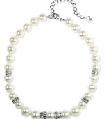 It's all about presentation, and this Givenchy necklace will turn heads. Crafted in silver tone mixed metal, necklace features a sweet strand of polished glass pearls (10 mm and 18 mm) accented by sparkling crystals. Approximate length: 16 inches.