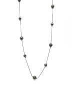 Alfani's long station necklace is sure to be a diverse, dramatic look within your jewelry collection. Crafted in hematite tone mixed metal. Approximate length: 42 inches.