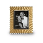 Handmade in sand-cast aluminum with a trademark blend of enamel infused with crushed mother of pearl, Julia Knight's peony picture frame features an artfully scalloped border inspired by flower petals.