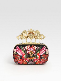 A truly stand-out statement piece with bright floral embroidery and a skull and unicorn accented knuckle duster closure.Knuckle duster top clasp closureLeather lining6¼W X 3½H X 1¼DMade in Italy A truly stand-out statement piece with bright floral embroidery and a skull and unicorn accented knuckle duster closure.Knuckle duster top clasp closureLeather lining6¼W X 3½H X 1¼DMade in Italy