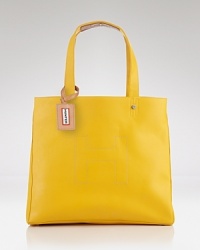 Inspired by their iconic boots, Hunter's rubber tote has a distinctly practical design. With a roomy interior and leather trims, this bag is a go-anywhere style that's chic rain or shine. Inspired by their iconic boots, Hunter's rubber tote has a distinctly practical design. With a roomy interior and leather trims, this bag is a go-anywhere style that's chic rain or shine.