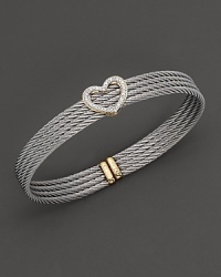 From the Classique collection, a yellow gold and stainless steel heart bangle. Designed by Charriol. From the Classique collection, a yellow gold and stainless steel heart bangle. Designed by Charriol.