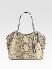 An exotic, python embossed leather design accented with shiny link chain details and a large tassel.Double chain and python embossed leather shoulder straps, 9½ dropTop zip closureOne inside zip pocketFour inside open pocketsFully lined13W X 12½H X 4½DImported An exotic, python embossed leather design accented with shiny link chain details and a large tassel.Double chain and python embossed leather shoulder straps, 9½ dropTop zip closureOne inside zip pocketFour inside open pocketsFully lined13W X 12½H X 4½DImported
