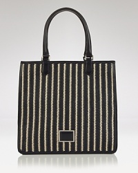 Take MARC BY MARC JACOBS' signature offbeat chic to the beach with this striped tote. In resort ready straw, this beachy bag lives to enliven a gauzy tunic and flat sandals. Take MARC BY MARC JACOBS' signature offbeat chic to the beach with this striped tote. In resort ready straw, this beachy bag lives to enliven a gauzy tunic and flat sandals.