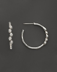 Faceted diamonds gleam in sterling silver hoops. By Ippolita. Faceted diamonds gleam in sterling silver hoops. By Ippolita.