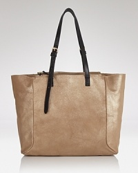 The tote bag gets a glamorous update from Foley + Corinna in rich suede with sturdy leather trims. Ideally sized to keep the essentials in place, it's all it a day's work. The tote bag gets a glamorous update from Foley + Corinna in rich suede with sturdy leather trims. Ideally sized to keep the essentials in place, it's all it a day's work.