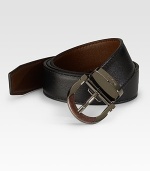 A modern classic crafted in reversible calfskin leather with an adjustable gancino buckle. Reverses from black to brown Leather Ruthenium buckle About 1 wide Made in Italy 