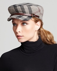 Brimming with Burberry, this wool cap is printed in a subtle gray check with a leather strap detail. Brimming with Burberry, this wool cap is printed in a subtle gray check with a leather strap detail.