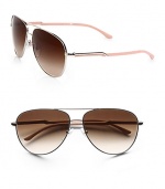 A modern take on a classic design in sleek metal with acetate logo temples. Available in gold/blond tortoise with brown gradient lens or silver/nude with brown gradient lens. Logo temples100% UV protectionMade in Italy 