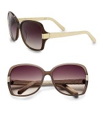 This luxurious resin frame is accented with exotic snakeskin wrapped temples. Available in mocha-cream skin with smoke gradient lens. Snakeskin temples100% UV protectionImported