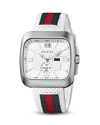 The Gucci Coupé range of watches takes inspiration from the House's golden eras and echoes the fluid lines of a sports car with a rounded-square silhouette. The Gucci Coupé range of watches takes inspiration from the House's golden eras and echoes the fluid lines of a sports car with a rounded-square silhouette.