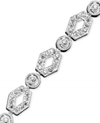 Old-world glamour for the modern woman. An elegant and ornate bracelet with gorgeous shimmer & crystal accents. Rhodium plated. Length measures 7 inches.