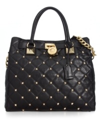 Elegance with an edge. Stud accents and chain-link detailing give this classic quilted tote from MICHAEL Michael Kors uptown rocker-chic appeal. Spacious, versatile and destined to be your go-to silhouette of the season. Elegance with an edge. Stud accents and chain-link detailing give this classic quilted tote from MICHAEL Michael Kors uptown rocker-chic appeal. Spacious, versatile and destined to be your go-to silhouette of the season.