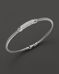 Diamonds, white gold and stainless steel on a modern, elegant bangle. By Charriol. Diamonds, white gold and stainless steel on a modern, elegant bangle. By Charriol.