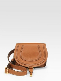 Classic travel essential in soft leather, detailed with contrast topstitching and tonal leather trim at the flap.Adjustable waist strap, 30-36 Flap with buckle and inside zip closure One inside open pocket One inside credit card slot Cotton lining 6W X 5H X 1½D Imported Classic travel essential in soft leather, detailed with contrast topstitching and tonal leather trim at the flap.Adjustable waist strap, 30-36 Flap with buckle and inside zip closure One inside open pocket One inside credit card slot Cotton lining 6W X 5H X 1½D Imported