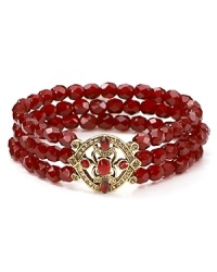 Three rows of rich garnet-hued glass stones, accented by an ornate 14-karat gold plated station define this Carolee bracelet that stretches for a perfect fit. Three rows of rich garnet-hued glass stones, accented by an ornate 14-karat gold plated station define this Carolee bracelet that stretches for a perfect fit.