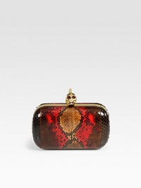A luxurious fire python style with a skull accented closure.Top clasp closureLeather lining6¼W X 3½H X 1¼DMade in Italy A luxurious fire python style with a skull accented closure.Top clasp closureLeather lining6¼W X 3½H X 1¼DMade in Italy